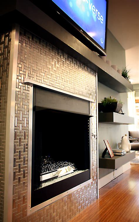 Get cozy and warm in the colder months by adding an electric fireplace to your home. Stainless Steel Tile Fireplace Surround | REDBUD ...
