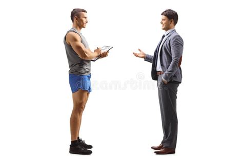 Full Length Profile Shot Of A Businessman Talking To A Personal Fitness
