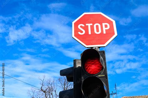 Stop Sign And Red Light At A Traffic Light At An Intersection Red Stop