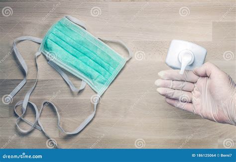 Surgical Mask Hand Sanitizer And Hand In Medical Gloves Stock Photo Image Of Clean Hand
