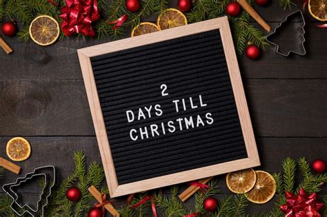 2 Days Till Christmas Countdown Letter Board On Wood Background Photo
