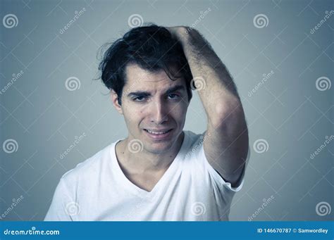Portrait Of Sad And Depressed Man Crying Suffering From Depression