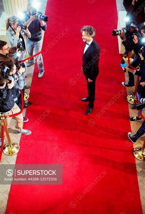 Celebrity Being Photographed By Paparazzi Photographers At Red Carpet