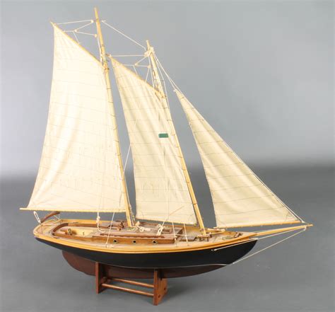 A Wooden Model Of A 2 Masted Sailing Ship 41h X 47w 13th April 2016