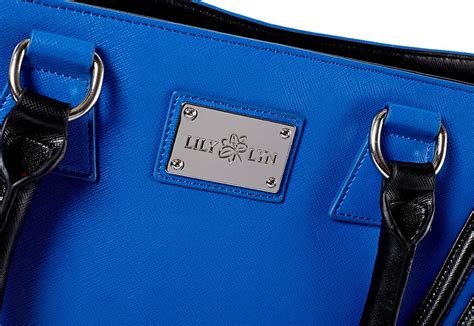 June Handbag In Cobalt Blue With Black Stripe Detail And A Floral
