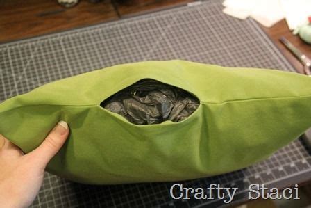 Fold over and stitch the fabric where the 'open' part is going to be on the cushion. Outdoor Pillows Stuffed with Plastic Bags — Crafty Staci ...