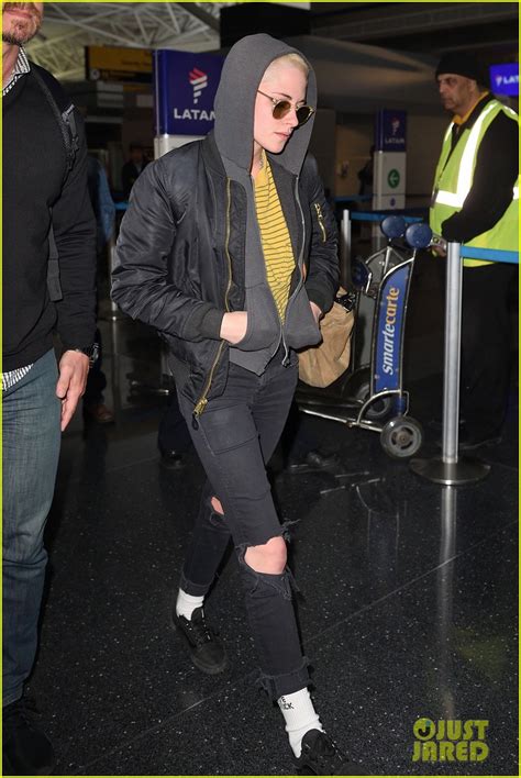 Kristen Stewart Covers Up New Buzzed Hair Arriving In Nyc Photo