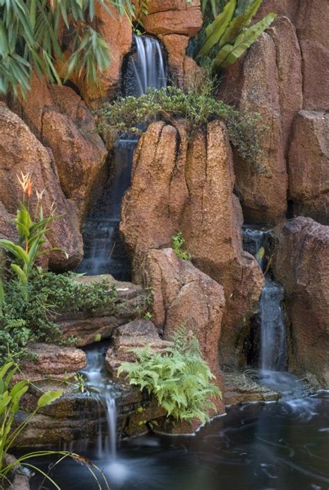 The Steep Cascades Of This Garden Waterfall Fall Into Two Streams