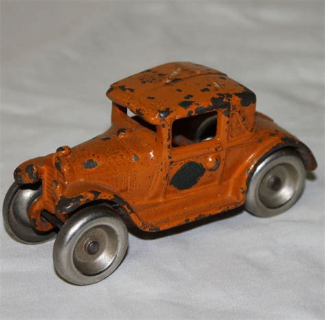 Bargain Johns Antiques Orange Antique Cast Iron Arcade Toy Car