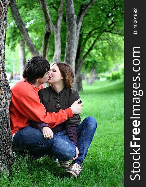 Couple Kissing Under A Tree Free Stock Images And Photos 10001892