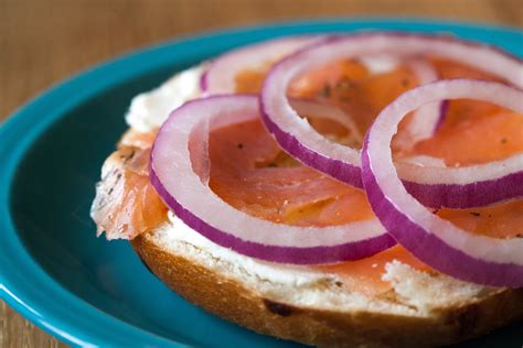 Roll smoked salmon with a mix neufchatel cheese (or cream cheese, or another light and soft cheese of your choosing), and either minced red onion, chives, roasted garlic, capers, minced olives, etc. How to Eat Cold Smoked Salmon (with Pictures) | eHow