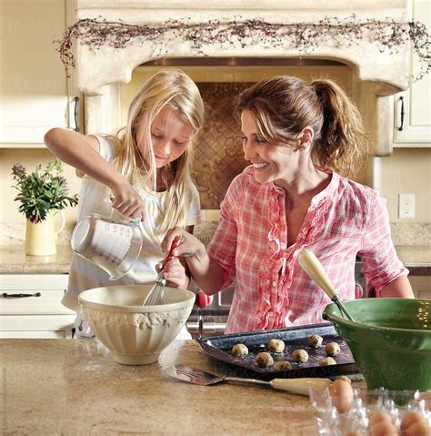 Mother And Daughter Baking Together In The Kitchen Del Colaborador De Stocksy Trinette Reed