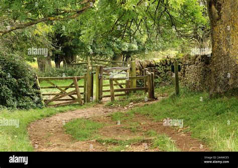 English Rural Landscape In The Cotswold Hills With Track Leading To A