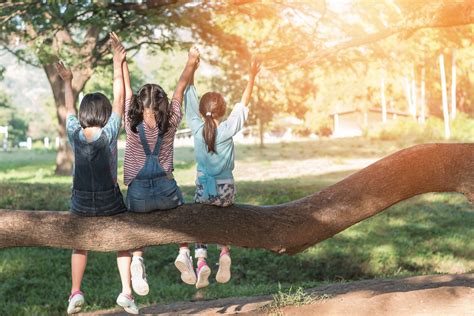 Children Friendship Concept With Happy Girl Kids In The Park Having Fun