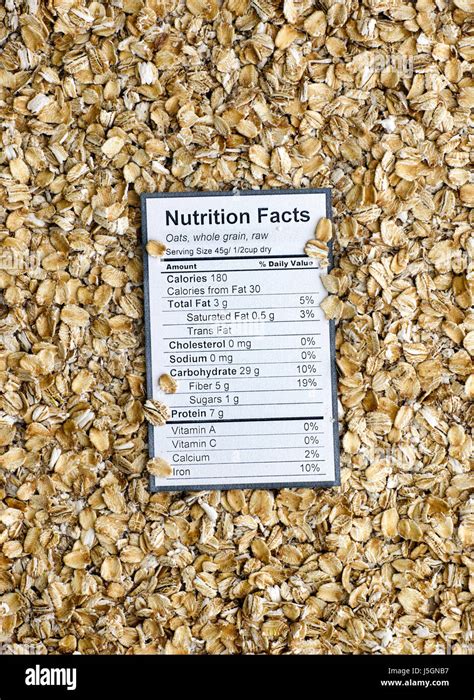 Nutrition Facts Of Whole Grain Raw Oats With Oats Background Stock