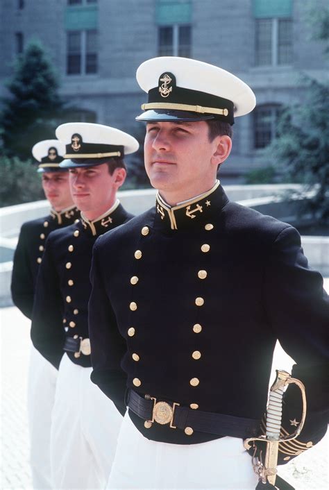 Midshipmen In Dress Uniforms Stand At Parade Rest During Noon Quarters