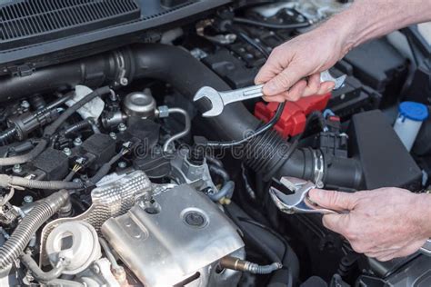Hands Of Car Mechanic Working On Car Engine Stock Photo Image Of