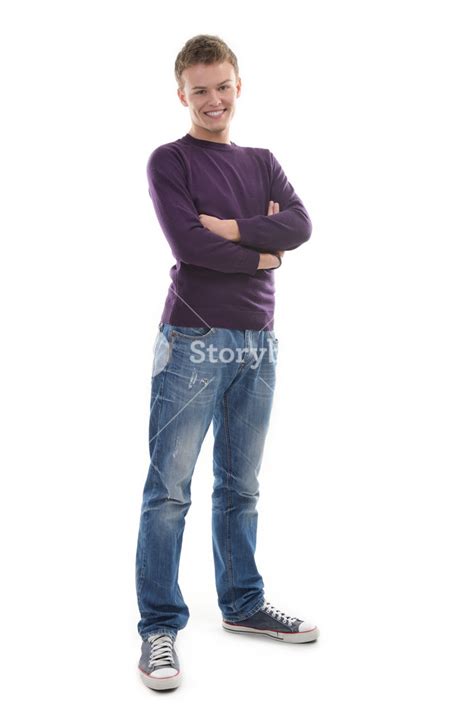 Friendly Young Man Posing With His Arms Crossed Royalty Free Stock