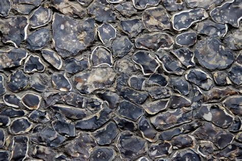 A Texture Of A Pebble Stone Wall Made Of Natural Stones Stock Photo
