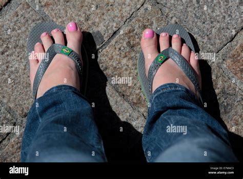 Girl With Nail Polish And Flip Flop Sandals Blue Jeans Relaxing On Holiday Free Spirit Stock