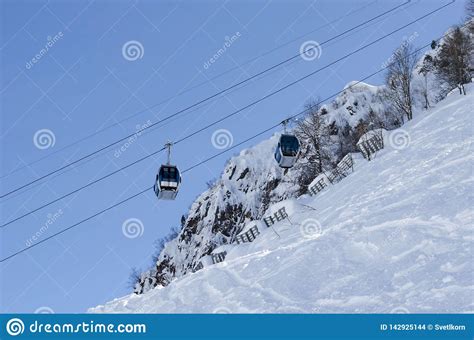 Ski Lift Sunny Day And Blue Sky Background Caucasus Mountains Ski