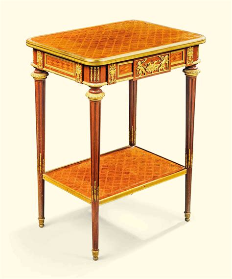 A French Ormolu Mounted Tulipwood And Parquetry Gueridon Of Louis Xvi