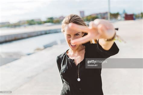 Happy Young Woman Posing Outdoors Photo Getty Images