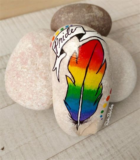 I Love Painting Rocks For A Good Cause A Rainbow Feather Painted Rock