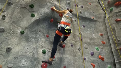 Woman Training On Practice Climbing Wall · Free Stock Video