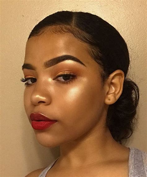 Red Lipstick And Highlight Makeup Look On Stylevore