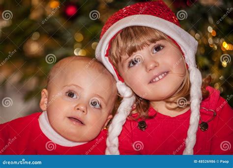 Brother And Sister Under Christmas Tree Stock Photo Image Of Glad