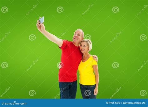 Composite Image Of Happy Mature Couple Taking A Selfie Together Stock Image Image Of Light