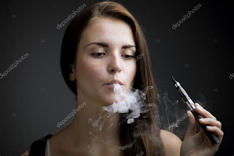 Elegant Woman Smoking E Cigarette With Smoke Stock Photo By