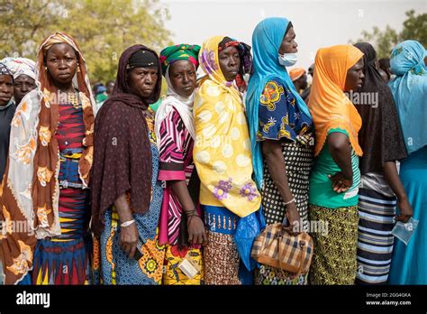 Women Line Up To Receive Food Assistance At A Idp Camp Distribution