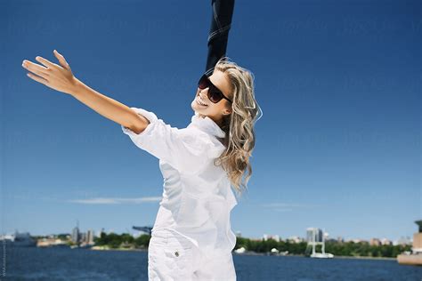 Happy Young Woman On Sail Boat By Stocksy Contributor Waa Stocksy