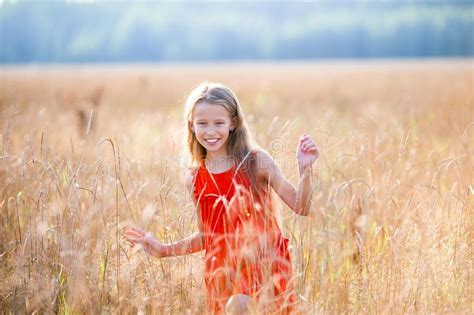Beautiful Little Blonde Girl Has Happy Fun Cheerful Smiling Face Red