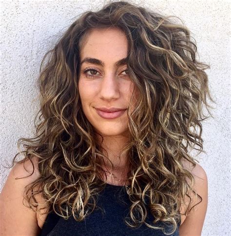 This gorgeous wavy long layered hair is the perfect and easy style for nearly every face shape. 50 Natural Curly Hairstyles & Curly Hair Ideas to Try in ...