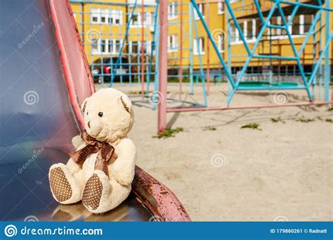 Forgotten Toy Teddy Bear In The Empty Quarantined Playground Stock