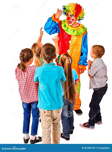 Child Clown Holds A Blank Poster In The Form Of A Cloud For Advertising