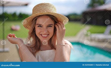 Happy Smiling Woman In Straw Hat Looking At Camera Enjoying Sunny Day