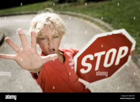 Boy On Driver Training Area Holding Stop Sign Stock Photo Alamy