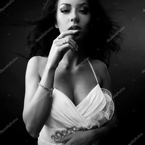 Black White Portrait Of Beautiful Brunette Woman In Fashionable Dress
