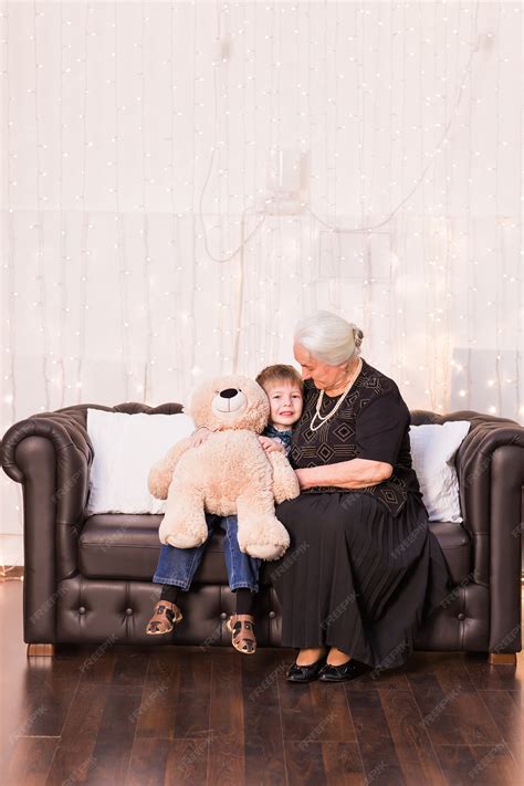 Premium Photo Portrait Of Happy Old Granny And Her Grandson Hugging