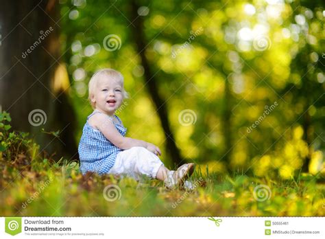 Cute Toddler Girl Sitting On The Grass On Summer Stock Image Image Of