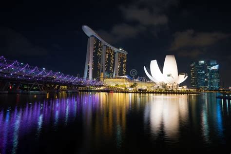 Singapore Business District Skyline With Helix Bridge In Night At