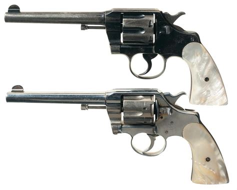 Collectors Lot Of Two Colt Double Action Revolvers With Pearl Grips A