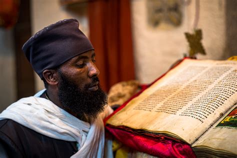 Ethiopian Monk A Monk Stands In Front Of An Orthodox Bible Flickr