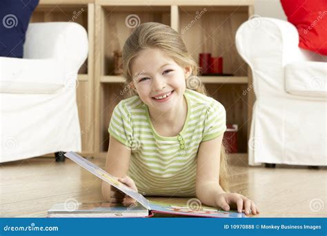 Young Girl Reading Book At Home Stock Photo Image Of Horizontal