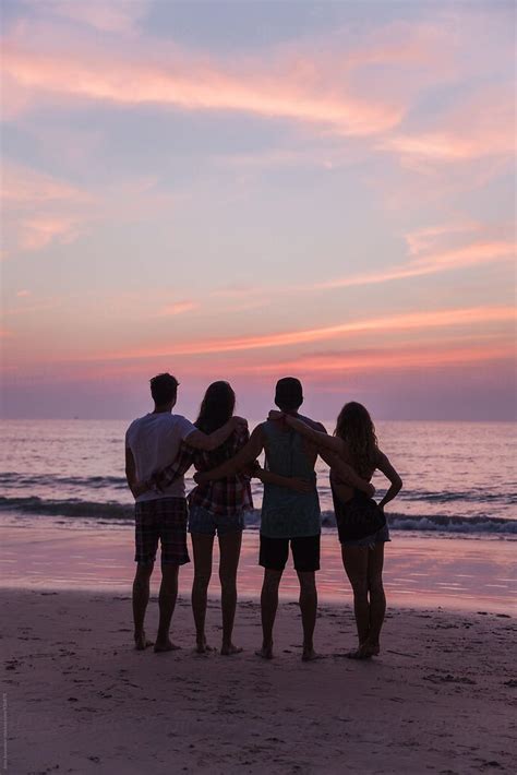Group Of Friends Watching Sunset Together At The Beach Stocksy United Instagram Selfies Bff