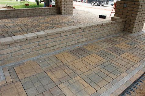 Define the patio area with the material that will contain your pavers. 16" x 16" EZ Slate Patio Block at Menards®